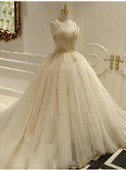 Champagne Ball Gown Tulle Spaghetti Straps Backless Wedding Dress